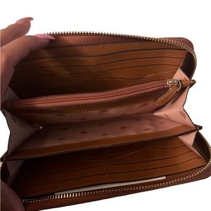Tan wallet used 4 times! In great condition worth the price!